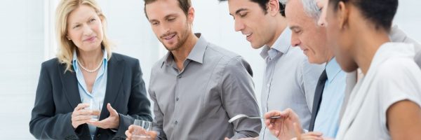 Business Colleagues Eating Meal Together In Restaurant